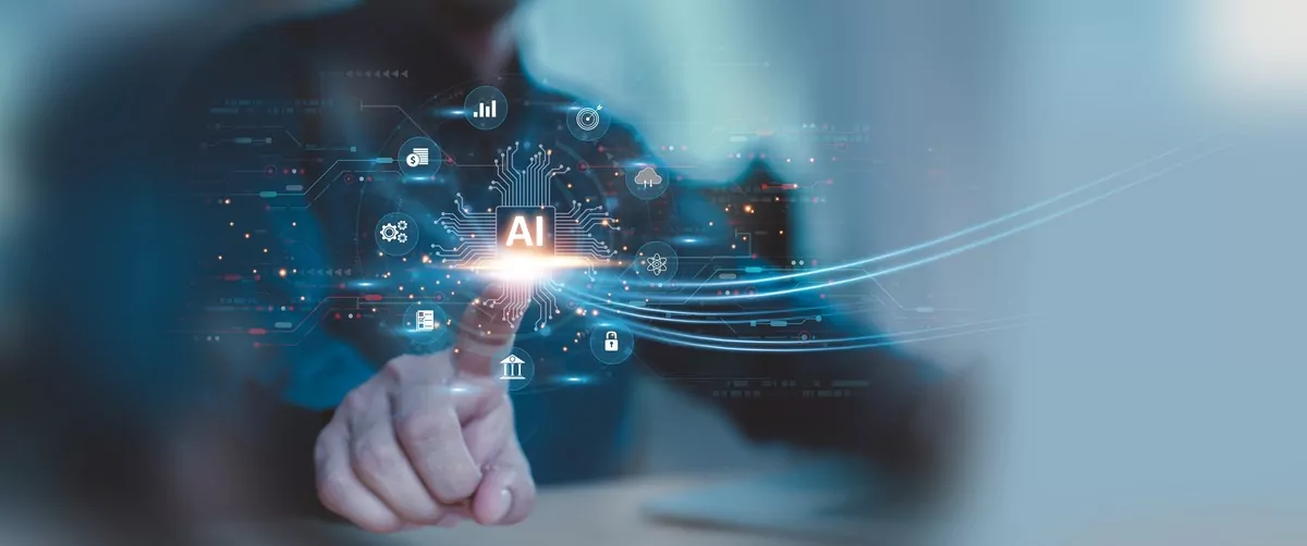 Human hand touching a flat screen with AI symbols on it